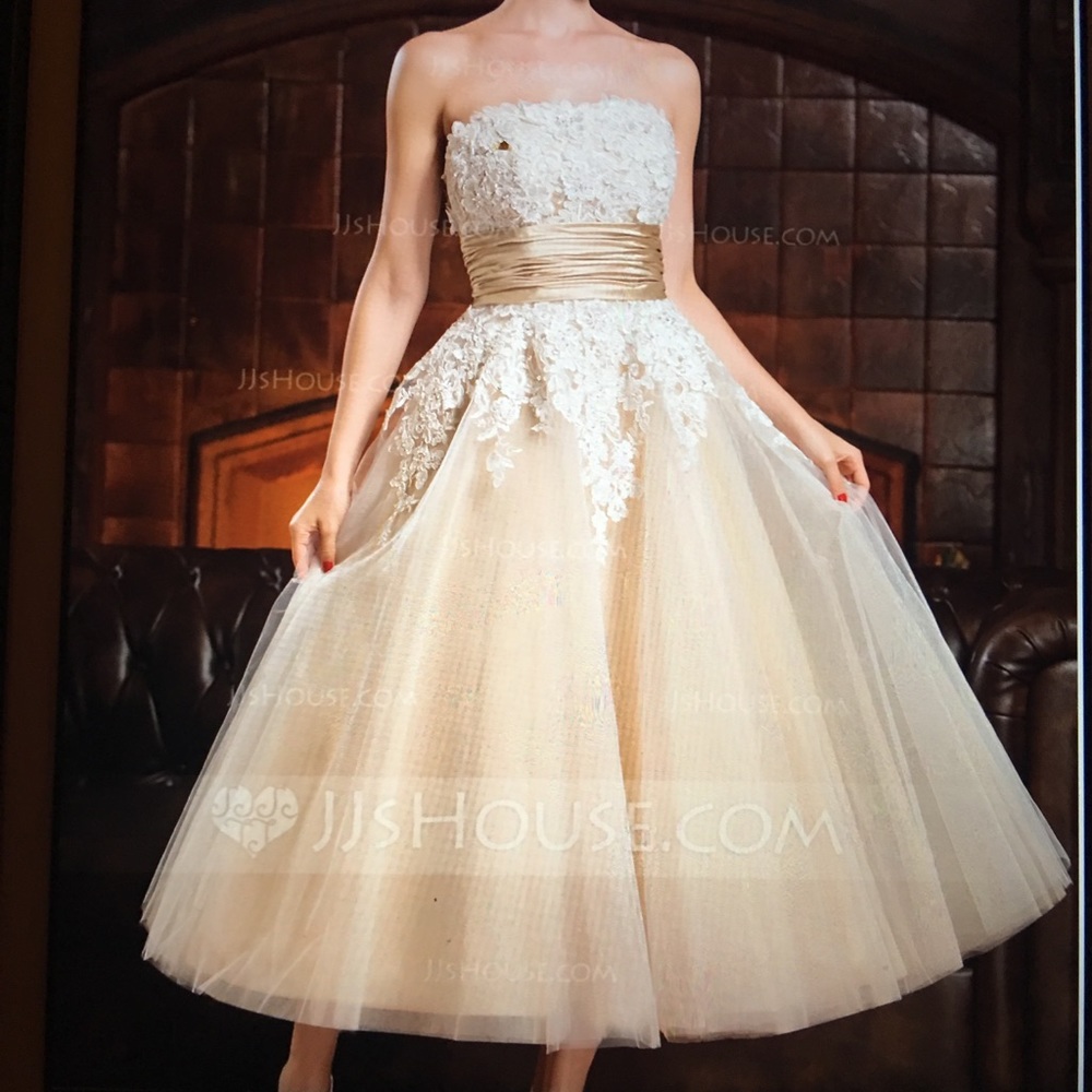 Strapless lace, tulle, corset and beaded gown.